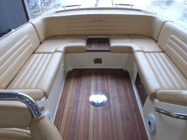 Slide: The Image of The image shows the cockpit of a 2012 Chris-Craft Corsair 28 with elegant leather seating. - 7
