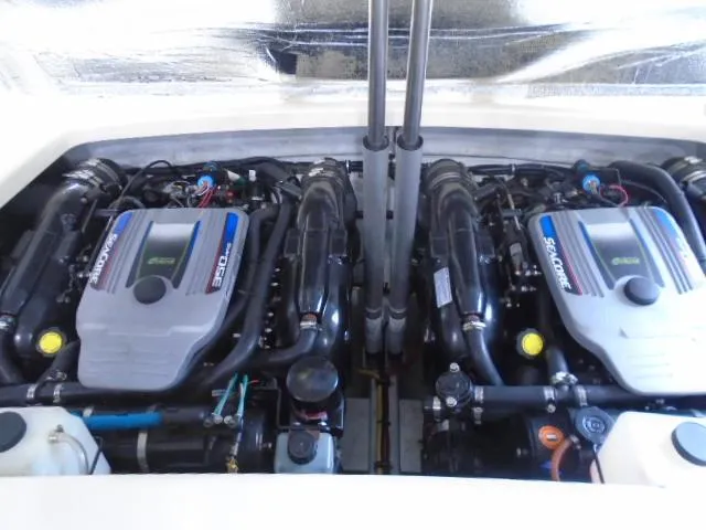 Slide: The Image of Two powerful engines in a 2012 Chris-Craft Corsair 28, clean and well-maintained. - 15