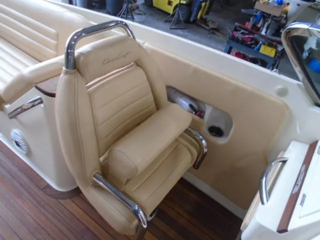 Slide: The Image of Beige leather seat with chrome accents in a Chris-Craft Corsair 28 boat. - 14