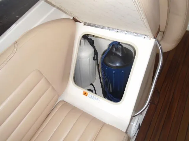 Slide: The Image of A storage compartment in the 2012 Chris-Craft Corsair 28 with fenders and ropes. - 12