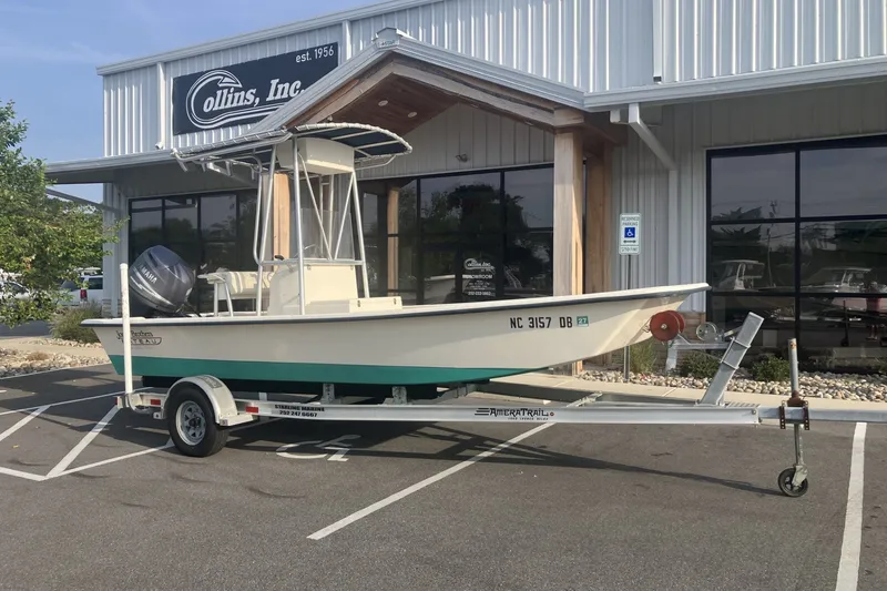 The Image of 2005 Jones Brothers Bateau 19 boat on trailer outside Collins Inc. building. - 1