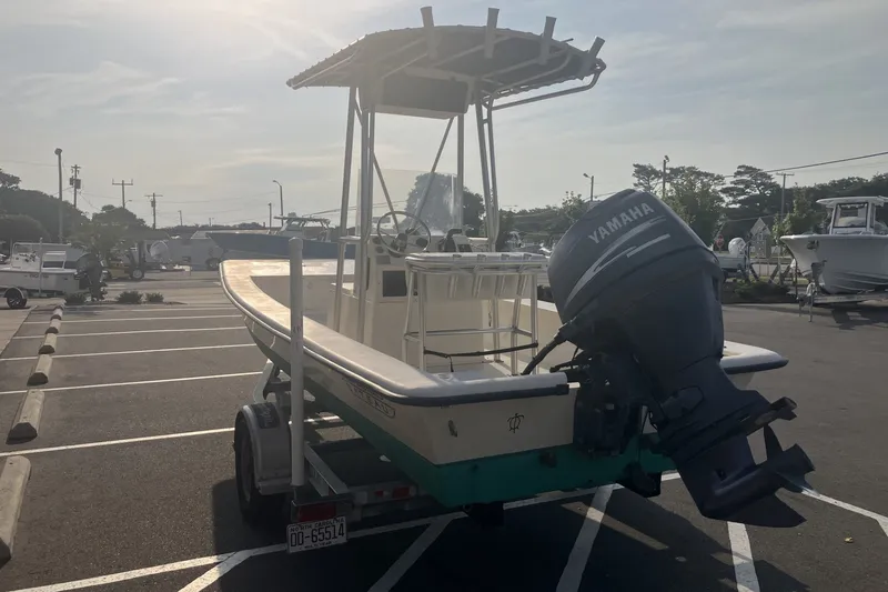 Slide: The Image of 2005 Jones Brothers Bateau 19 boat with Yamaha motor on trailer in parking lot. - 8