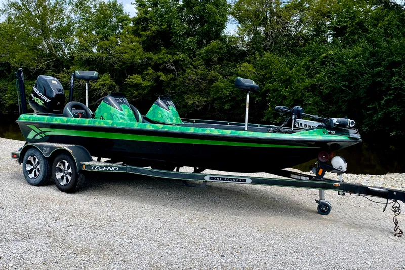 The Image of Legend V-20 2017 on a trailer, green and black design, with motor and equipment. - 1