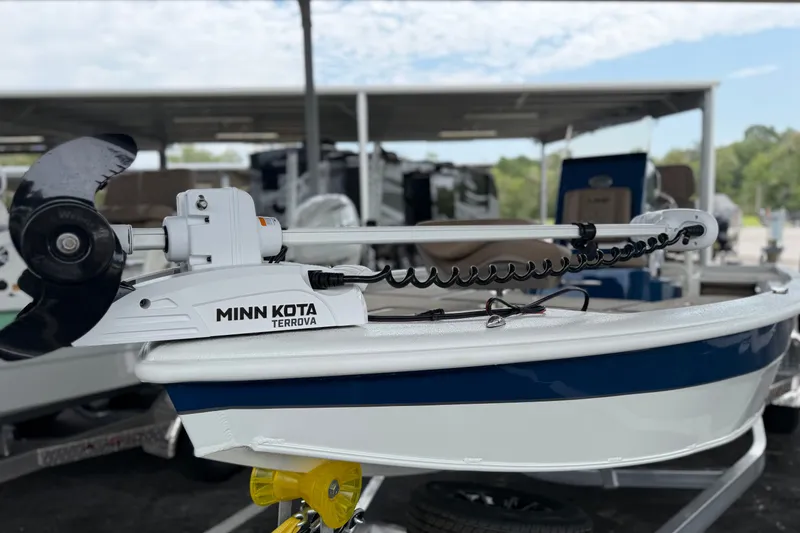Slide: The Image of Avid 21 FSX 2027 boat with Minn Kota Terrova motor in a marina setting. - 18