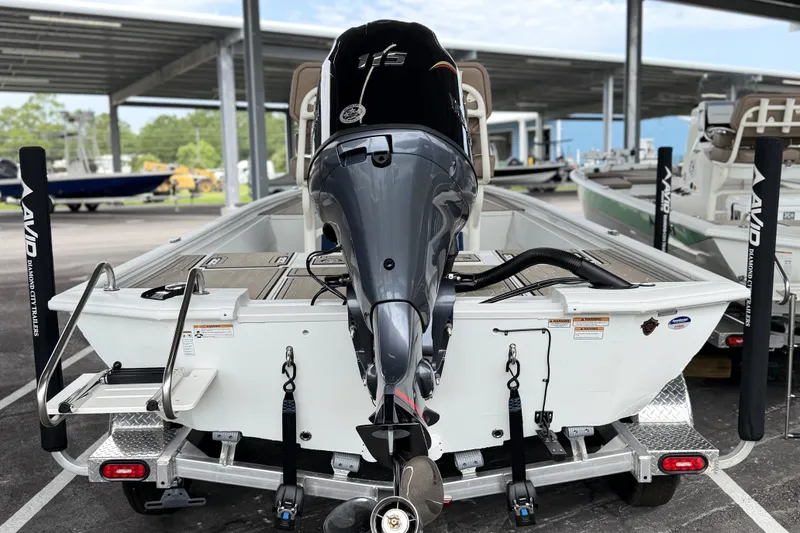 Slide: The Image of Avid 21 FSX 2027 boat with powerful outboard motor on trailer. - 21