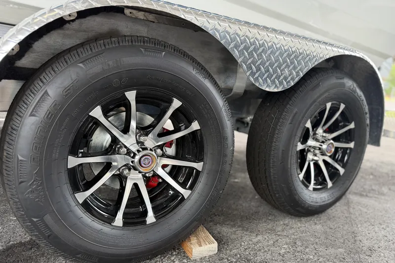 Slide: The Image of Trailer wheels of 2027 Avid 21 FSX with chrome rims and diamond plate fender. - 19