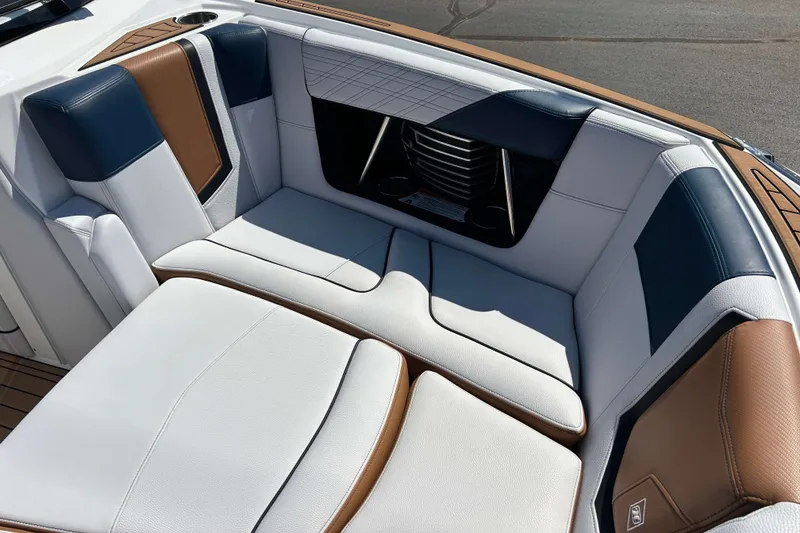 Slide: The Image of Luxurious seating in 2019 Nautique Super Air Nautique G21 boat, featuring elegant upholstery design. - 19