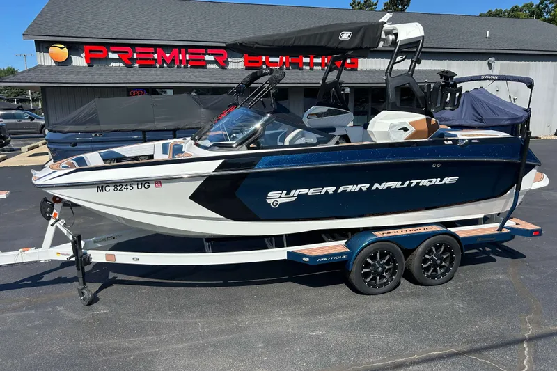 The Image of 2019 Nautique Super Air Nautique G21 boat on trailer at Premier Boating dealership. - 0