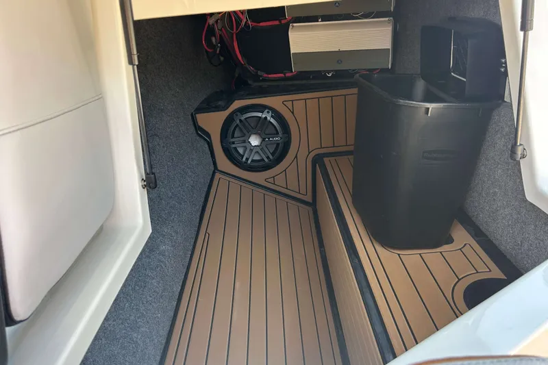 Slide: The Image of 2019 Nautique Super Air Nautique G21 interior storage with speaker and equipment. - 17