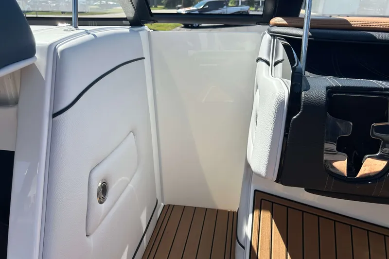 Slide: The Image of 2019 Nautique Super Air Nautique G21 interior with sleek white and black design. - 15
