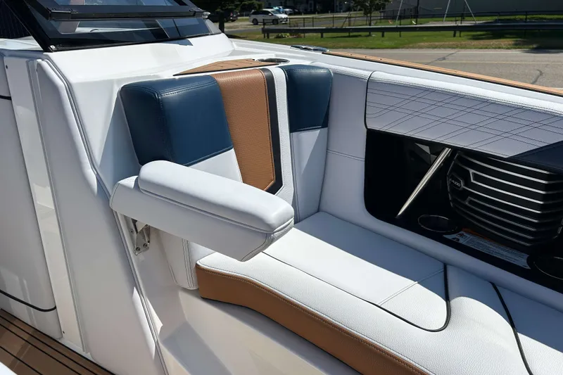 Slide: The Image of 2019 Nautique Super Air Nautique G21 interior seating with stylish upholstery and armrest. - 24
