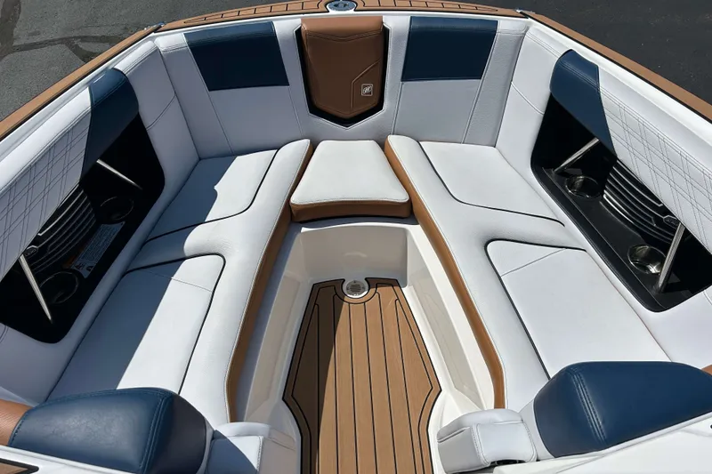 Slide: The Image of 2019 Nautique Super Air Nautique G21 boat interior with white and tan seating. - 21