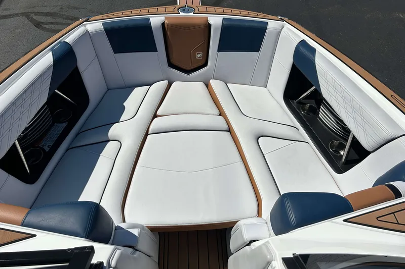 Slide: The Image of Luxurious seating in 2019 Nautique Super Air Nautique G21 boat interior. - 18
