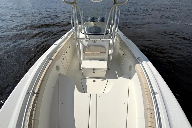 Slide: The Image of 2007 Hydra-Sports Vector 2500 CC boat on water, showcasing spacious deck and seating. - 16