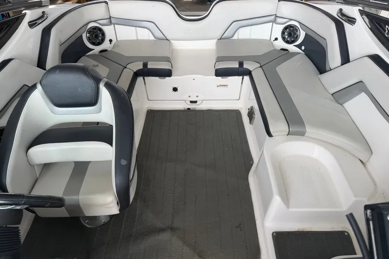 Slide: The Image of Interior of a 2015 Yamaha Boats 212X, featuring sleek seating and modern design. - 4