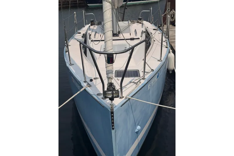 Slide: The Image of 2015 Catalina 275 Sport sailboat docked, featuring sleek design and modern rigging. - 1