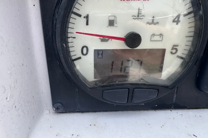 Slide: The Image of Close-up of a Catalina 275 Sport 2015 boat gauge displaying 1127 hours. - 8