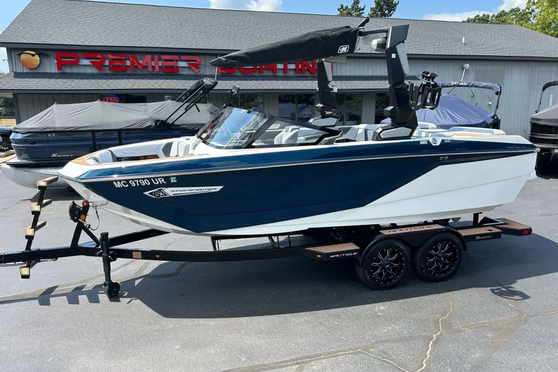 The Image of 2022 Nautique Super Air Nautique G21 boat on trailer at dealership. - 0