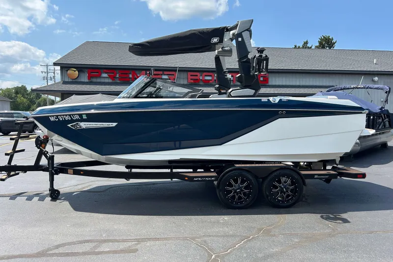 Slide: The Image of 2022 Nautique Super Air Nautique G21 boat on trailer at Premier Boating dealership. - 20
