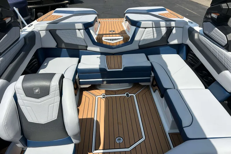 Slide: The Image of Luxurious interior of 2022 Nautique Super Air Nautique G21 boat with stylish seating. - 16