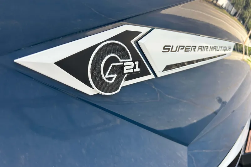 Slide: The Image of 2022 Nautique Super Air Nautique G21 logo on blue surface. - 22