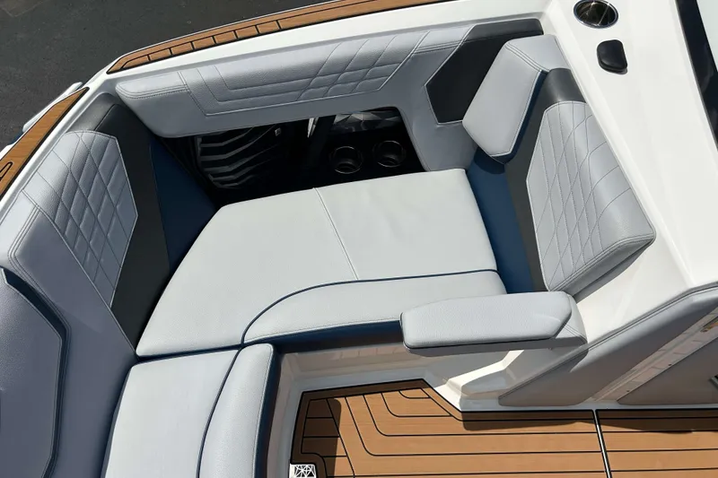 Slide: The Image of 2022 Nautique Super Air Nautique G21 interior seating with elegant upholstery and teak flooring. - 14