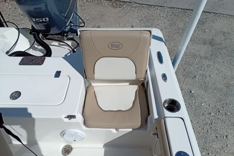 Slide: The Image of 2016 Key West 210 Bay Reef boat seat and Yamaha 150 engine detail. - 15