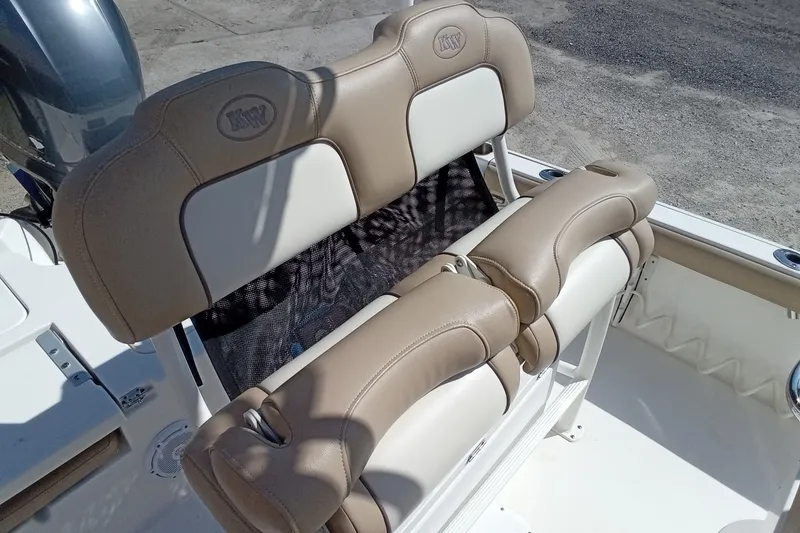 Slide: The Image of 2016 Key West 210 Bay Reef boat seating with tan upholstery and KW logo. - 23