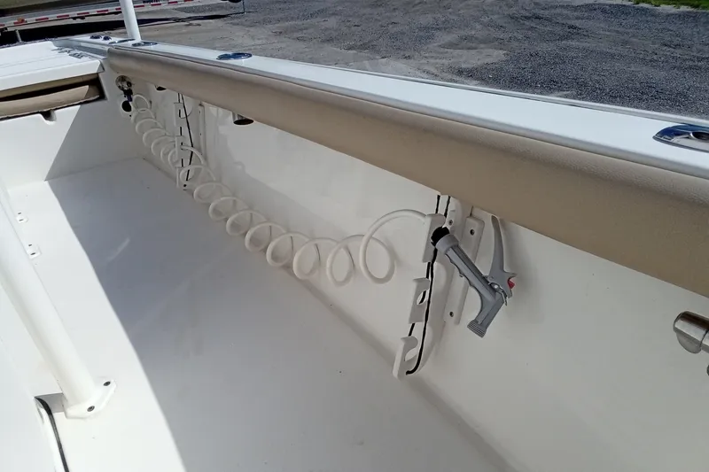 Slide: The Image of Interior view of a 2016 Key West 210 Bay Reef boat with coiled hose attachment. - 20