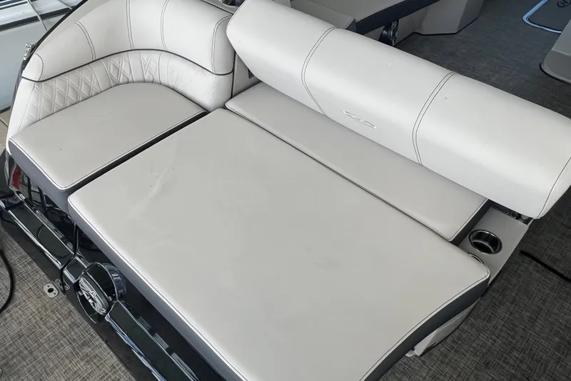 Slide: The Image of 2023 Harris Crowne SL 250 boat interior with luxurious white seating. - 24
