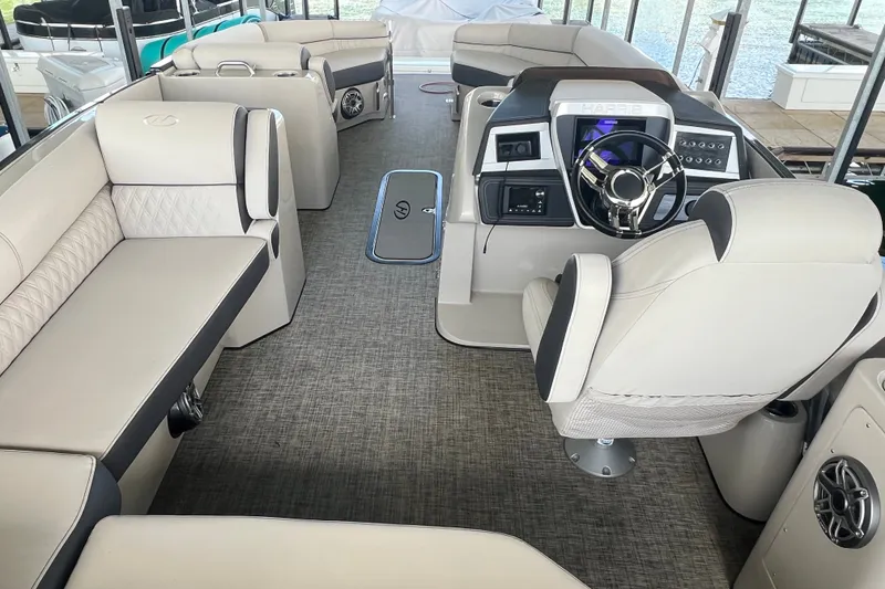 Slide: The Image of Luxurious interior of 2023 Harris Crowne SL 250 pontoon boat with plush seating and modern helm. - 26