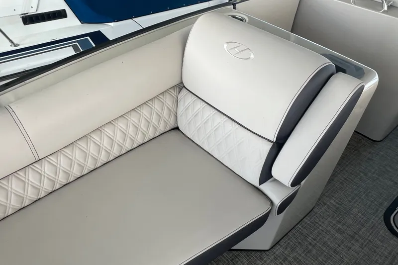 Slide: The Image of Luxurious seating on 2023 Harris Crowne SL 250 boat with elegant diamond stitching. - 21