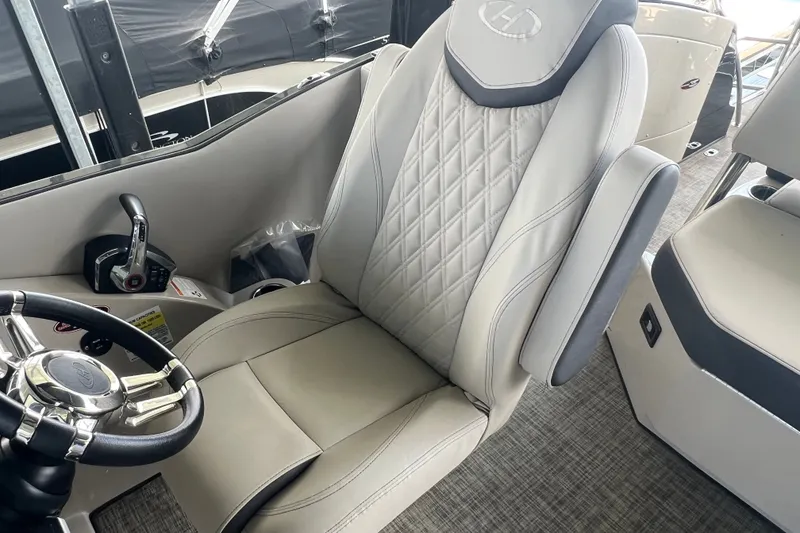 Slide: The Image of Luxurious interior of 2023 Harris Crowne SL 250 boat with plush seating and modern controls. - 19
