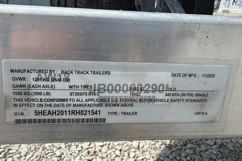 Slide: The Image of 2024 Xpress H18 Bass trailer label showing specifications and manufacturing details. - 14