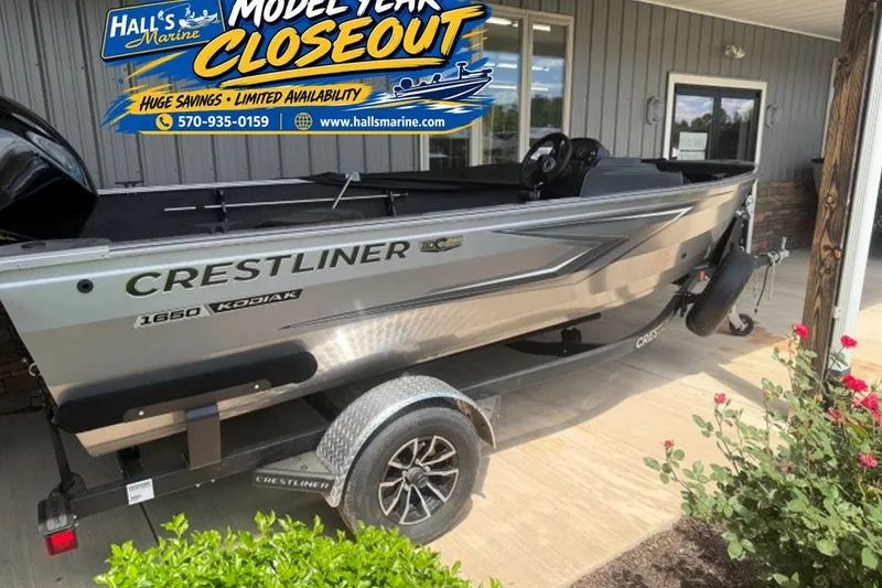 The Image of 2026 Crestliner 1650 Kodiak SC boat on trailer at Hall's Marine closeout sale. - 0