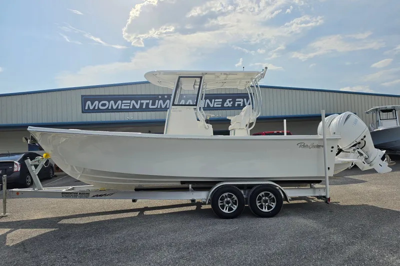 The Image of 2027 Pair Customs 24 Center Console DV Offshore boat on trailer at dealership. - 1