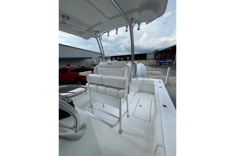 Slide: The Image of 2027 Pair Customs 24 Center Console DV Offshore boat interior with seating and canopy. - 15