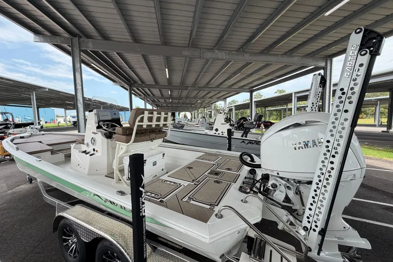 Slide: The Image of Avid 23 Fusion 2027 boat under covered storage, featuring Yamaha engine and advanced equipment. - 3