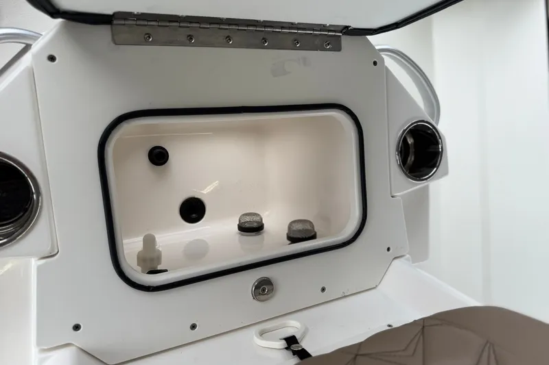 Slide: The Image of Interior compartment of 2027 Avid 23 Fusion boat, featuring storage and utility elements. - 10