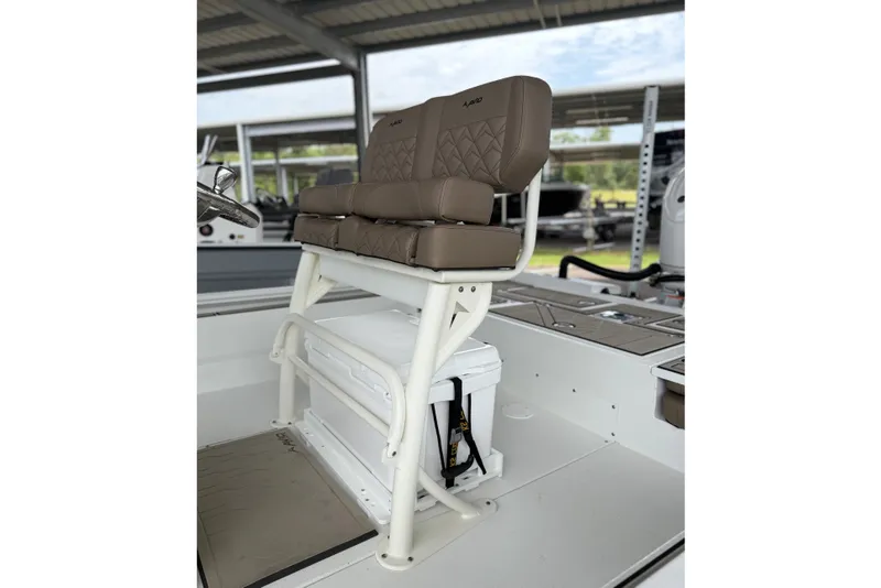 Slide: The Image of 2027 Avid 23 Fusion boat seat with brown cushions and white frame. - 18