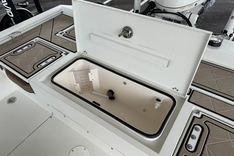 Slide: The Image of Open storage compartment on 2027 Avid 23 Fusion boat deck. - 8