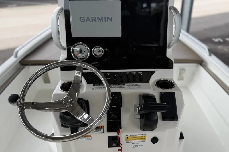 Slide: The Image of Steering console of 2027 Avid 23 Fusion boat with Garmin navigation system. - 13