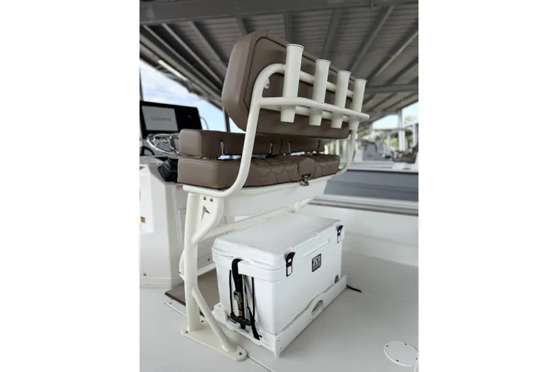 Slide: The Image of Avid 23 Fusion 2027 boat seat with rod holders and cooler storage. - 15