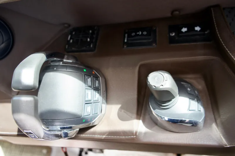 Slide: The Image of Control panel of a 2020 Cobalt A36 boat, featuring throttle and joystick controls. - 16