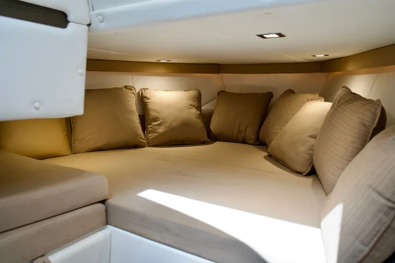 Slide: The Image of Luxurious interior cabin of 2020 Cobalt A36 boat with plush beige cushions. - 19