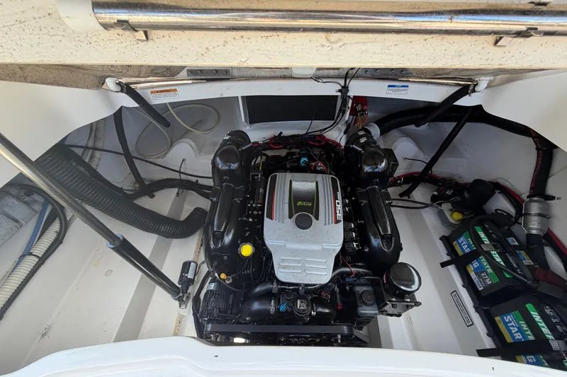Slide: The Image of Engine compartment of a 2014 Sea Ray SLX 250 boat, featuring a MerCruiser engine. - 30