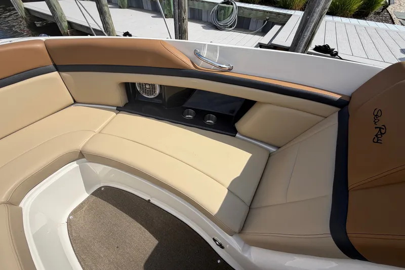 Slide: The Image of Interior seating of a 2014 Sea Ray SLX 250 boat with tan upholstery. - 7