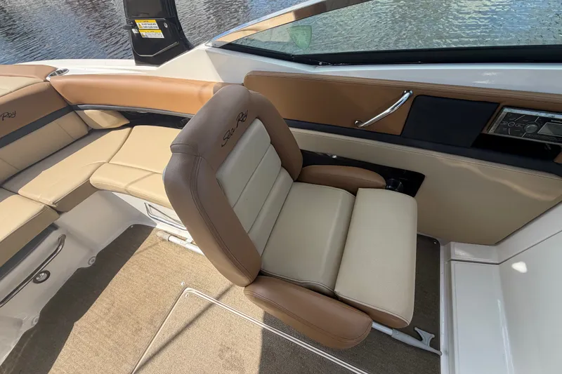 Slide: The Image of 2014 Sea Ray SLX 250 boat interior with beige seating and sleek design. - 20