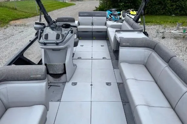 Slide: The Image of 2023 Sea-Doo Switch Cruise 21 pontoon boat interior with spacious seating and modern design. - 11