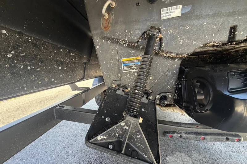 Slide: The Image of Close-up of 2023 Sea-Doo Switch Cruise 21 underside, showing mechanical components and wear. - 6